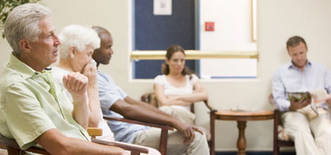 Five people in a waiting room